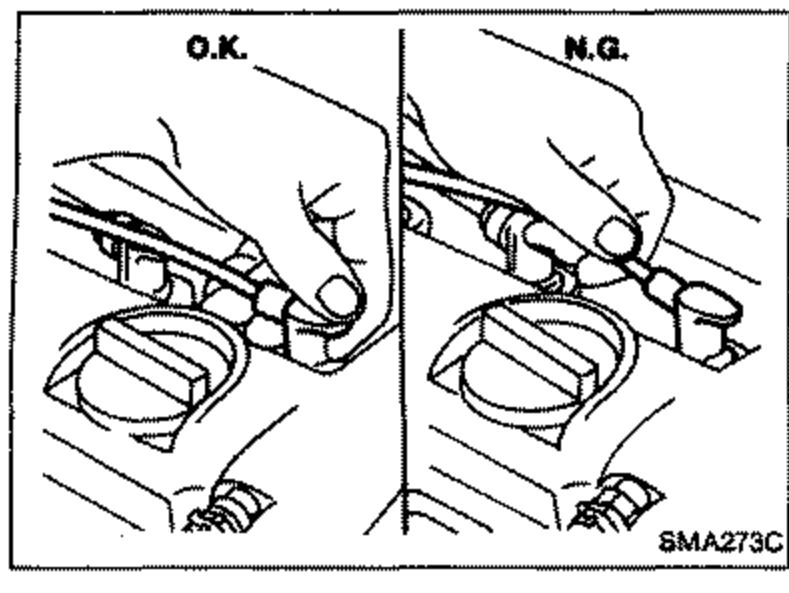 Comparison of spark plug electrode condition showing 'O.K.' and 'N.G.' examples, disconnecting ignition wires from spark plugs.