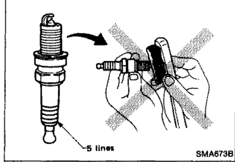 Platinum-tipped spark plug with a hand and wire brush marked with a large X (do not use a wire brush for cleaning). Callout '5 lines' pointing to the plug.