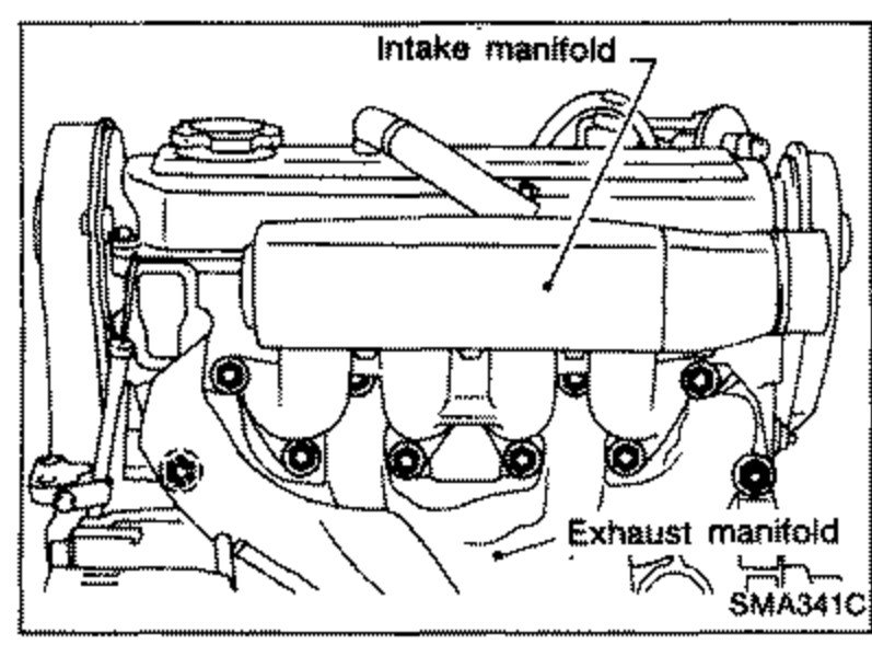 Line drawing of the cylinder head showing the intake manifold (labeled at top) and the exhaust manifold (labeled at lower right) mounting locations on the CD20 engine.