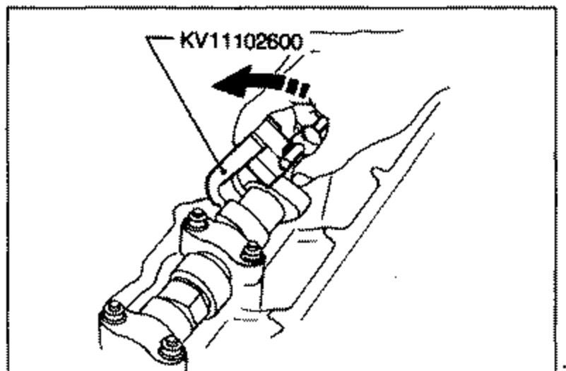 Line drawing showing special tool KV11102600 being set between the cams on the camshaft for valve clearance adjustment. An arrow indicates the tool.