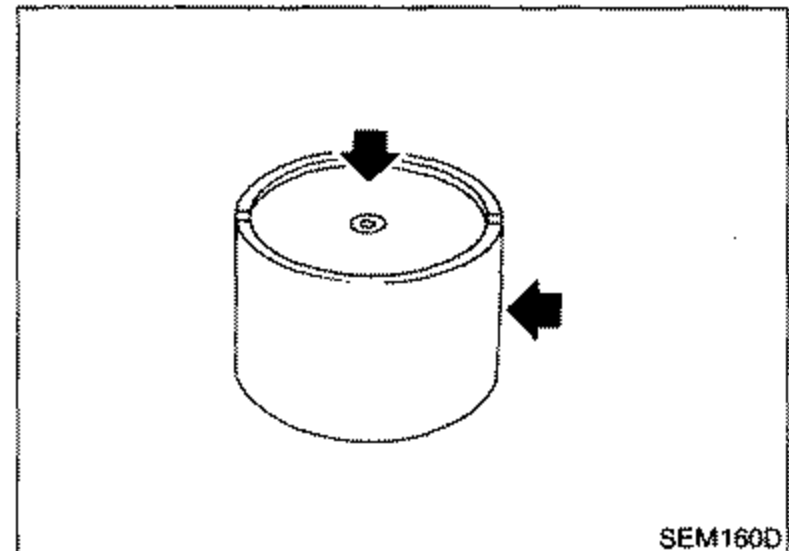 Valve lifter shown as a cylinder with two arrows (one pointing down from the top, one pointing in from the right side) indicating the contact and sliding surfaces to check for wear or scratches.