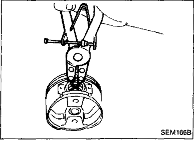 Installing a new snap ring into one side of the piston pin hole using snap-ring pliers on the piston.