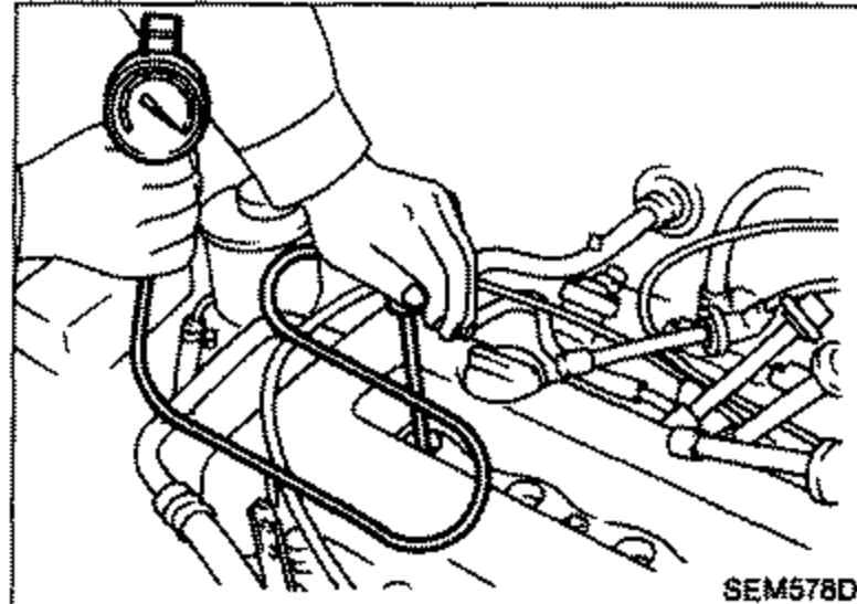 Hand attaching a compression tester to the spark plug hole of the No. 1 cylinder on the engine.