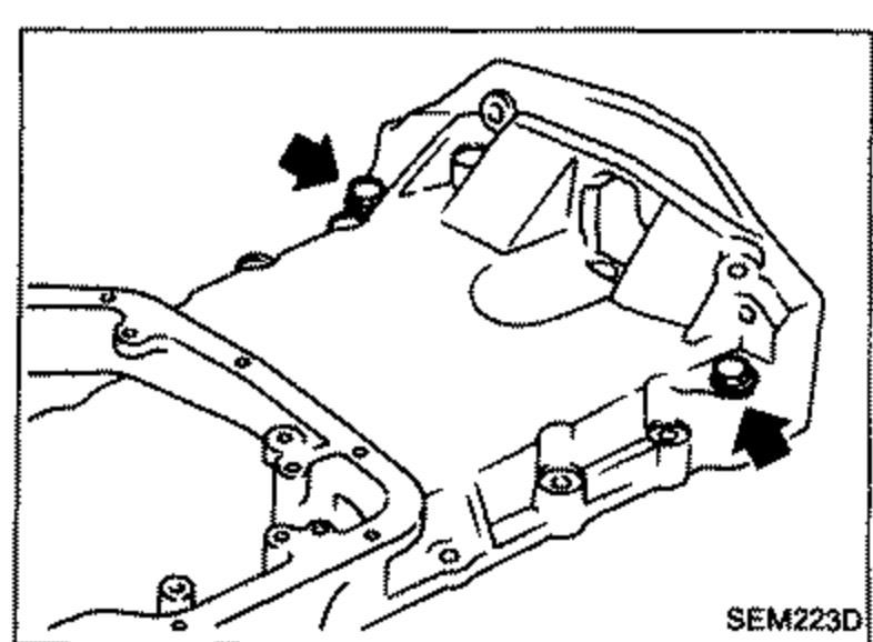 Aluminum oil pan with the two engine-to-transaxle bolts (previously installed for separation) being removed; arrows point to the bolt locations.