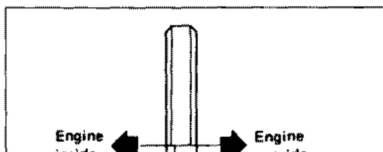 A hand using a screwdriver-type tool to pry out the front oil seal from the front cover. Illustrates removal of the front oil seal taking care not to scratch the front cover.