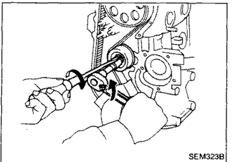 Loosening the timing belt tension lock nut and rotating tension; wrench engaging the tensioner.