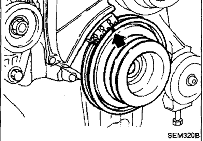 Front of the engine showing the crankshaft pulley/sprocket with a T.D.C. timing mark and arrow, used to set No. 1 cylinder at T.D.C.