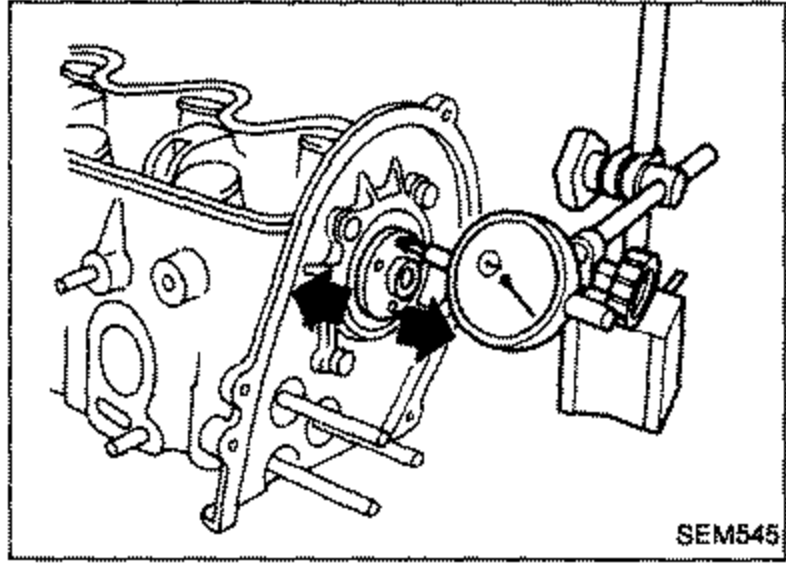 Dial gauge mounted to measure camshaft end play with camshaft and front cover installed in cylinder head.
