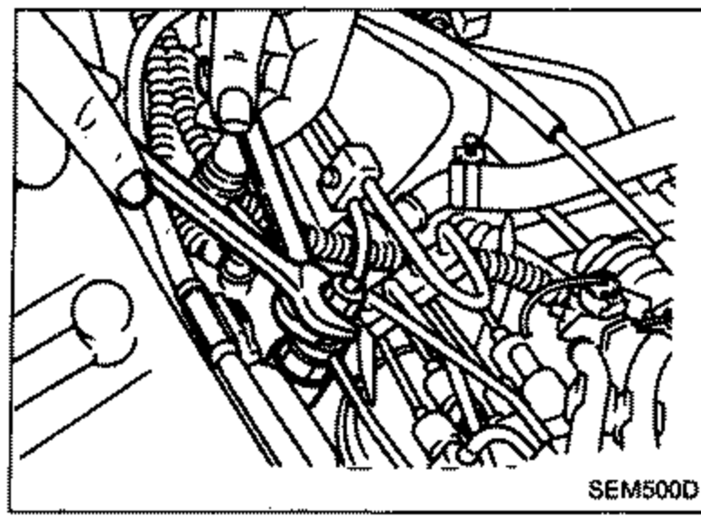 Photo of the CD20 engine top, showing injection tubes connecting the injection pump to the nozzles. Hands/wrenches area for disconnecting injection tubes.
