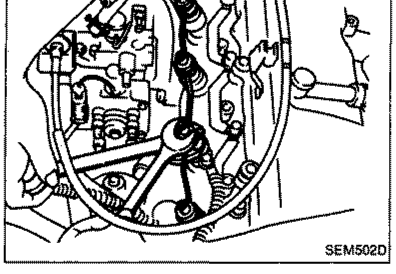 Photo of the engine showing the spill-tube assembly being removed at the nozzle holders.