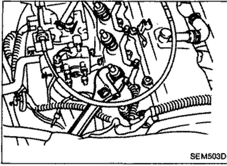Photo of the engine showing removal of the injection nozzles using a suitable tool.