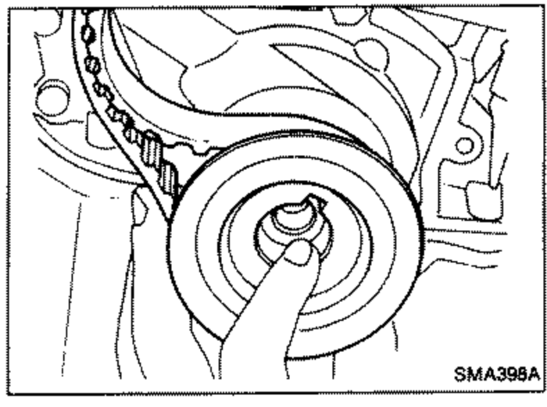 Photo showing the timing belt being removed together with the crankshaft sprocket.