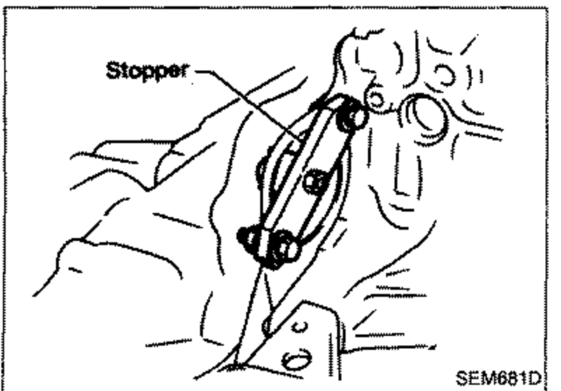 Illustration showing a ring gear stopper labeled 'Stopper' installed using mounting bolt holes to lock the engine for crank pulley bolt removal.