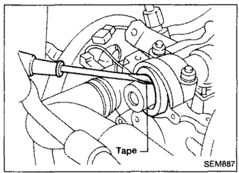 Camshaft front area with a suitable tool and 'Tape' applied, illustrating pulling out the camshaft oil seal.