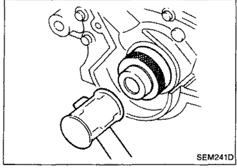 Crankshaft front oil seal being installed with a suitable tool after applying engine oil to the new seal.