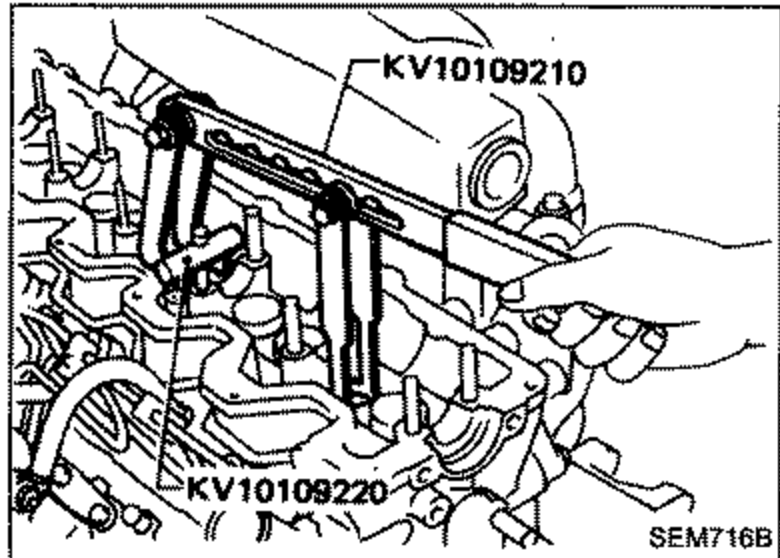 Special service tools KV10109210 and KV10109220 used to remove valve component parts (valve spring compressor) on the cylinder head.