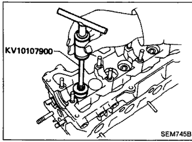 Special tool KV10107900 used to remove valve oil seals from the cylinder head.