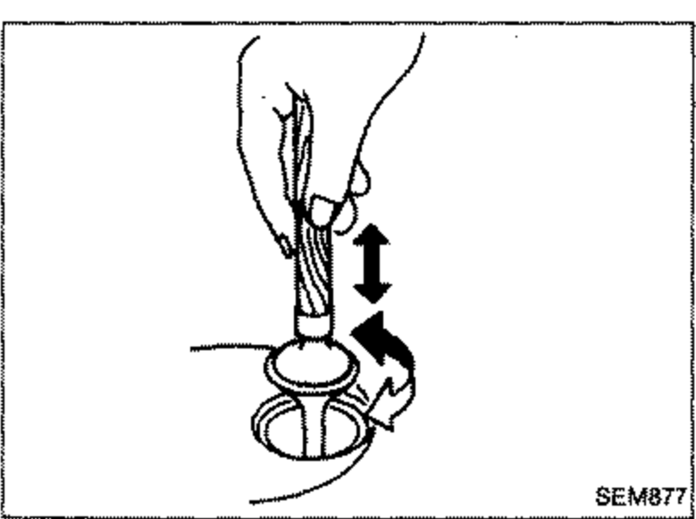 Hand-held lapping tool applying grinding compound and lapping a valve against its seat (up/down and rotational arrows shown).