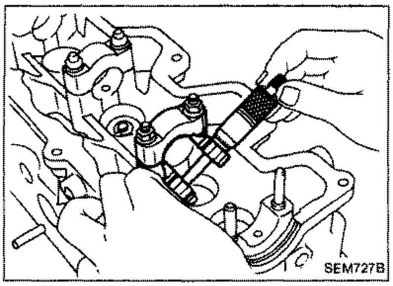 Inside micrometer / bore gauge measuring the inner diameter of camshaft bearings in the cylinder head with bracket bolts tightened.