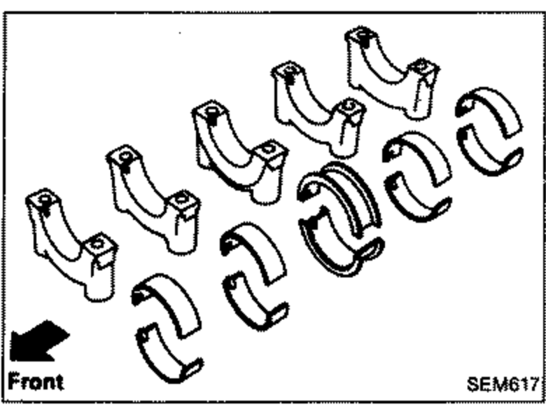 Set of main bearings and bearing caps laid out, with 'Front' label and arrow at lower left indicating front orientation.