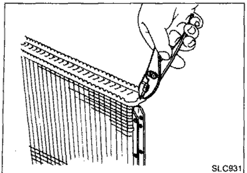Illustration of a hand making sure the crimped edge of the radiator core stands straight up.