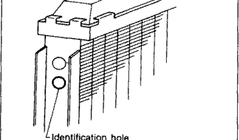 Illustration of the radiator core with a leader line pointing to the 'Identification hole' on the side of the radiator core, used to determine which sealing rubber to install.