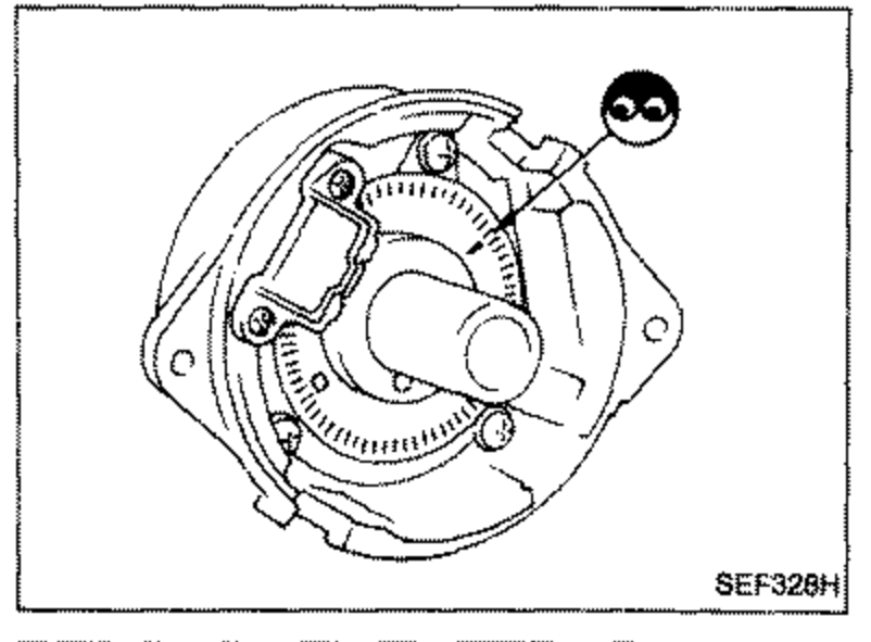 Signal plate / reluctor disc of the crank angle sensor viewed from the front, showing the toothed signal plate inside the distributor body. A solid arrow points to a marking near the top right.