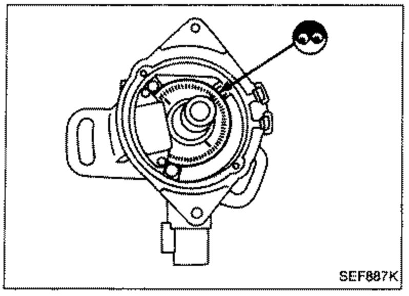 Top view of the crank angle sensor signal plate / rotor inside the distributor housing, used to visually check the signal plate for damage or dust.