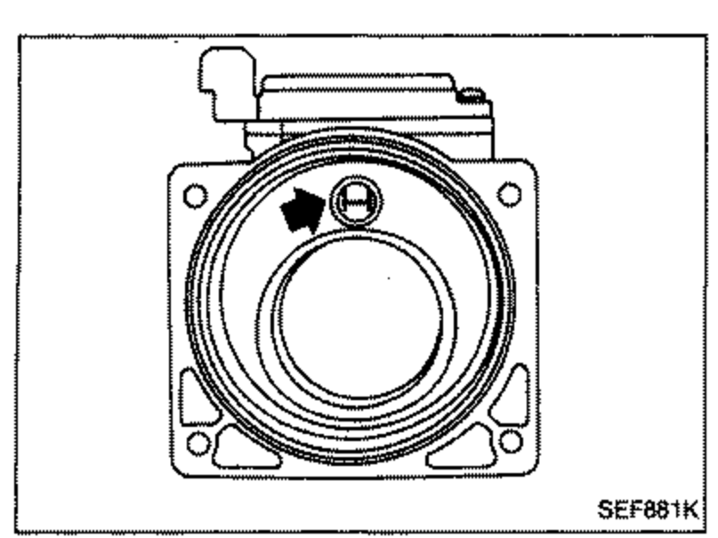 Top view of the air flow meter hot wire element; an arrow points to the hot wire located in the bore, for inspecting the hot wire for damage or dust.