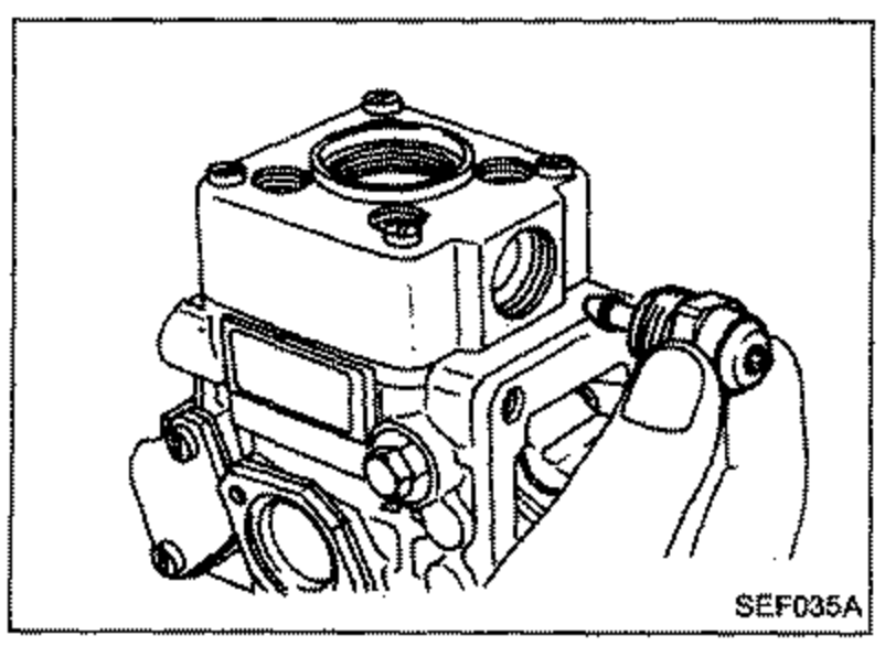 Pump with a tool removing the fuel cut solenoid valve from the side.
