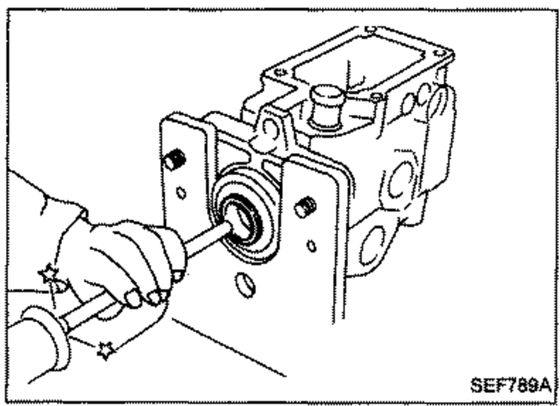 Oil seal being installed onto the pump body with a tool from the left side.