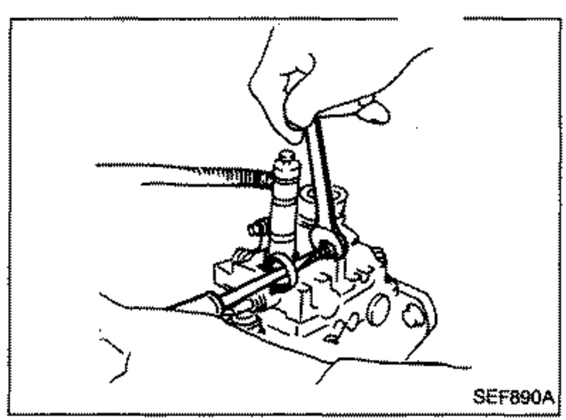 Illustration of the VE-type injection pump idle adjustment area, showing a hand/screwdriver adjusting the idle speed adjusting screw on the top of the pump.