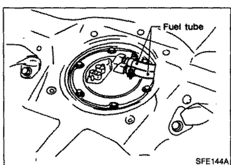 Top view of the fuel pump/gauge unit mounting plate with fuel tube (labeled) and connectors visible, showing the six screws to be removed.